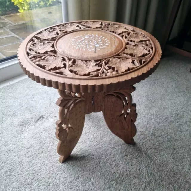 Beautiful hand carved wooden side table with fold down legs