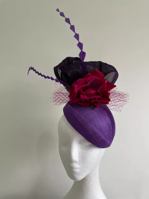 Purple air hostess fascinator with loops, magenta flowers and feathers!