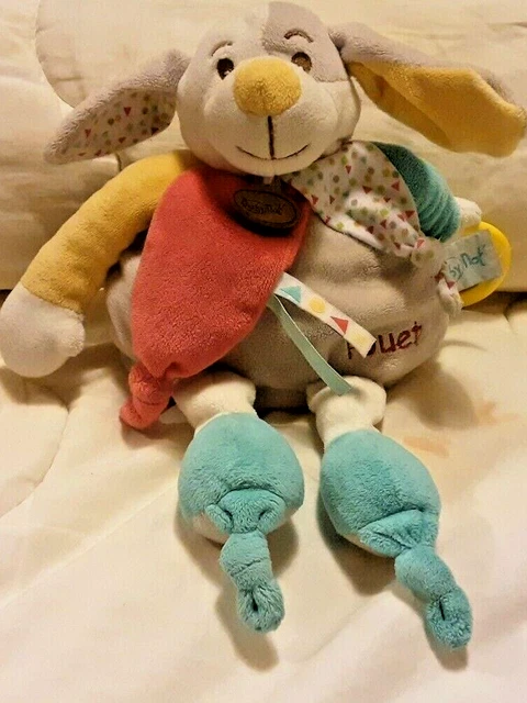 Doudou Peluche Chien rouge bleu jaune Grelot Pouet d activités Baby Nat