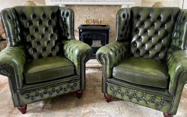 Pair of  Chesterfield Green leather chairs wing back armchairs