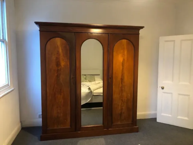 Flame mahoganyantique gentlemans wardrobe with hanging space drawers and shelves