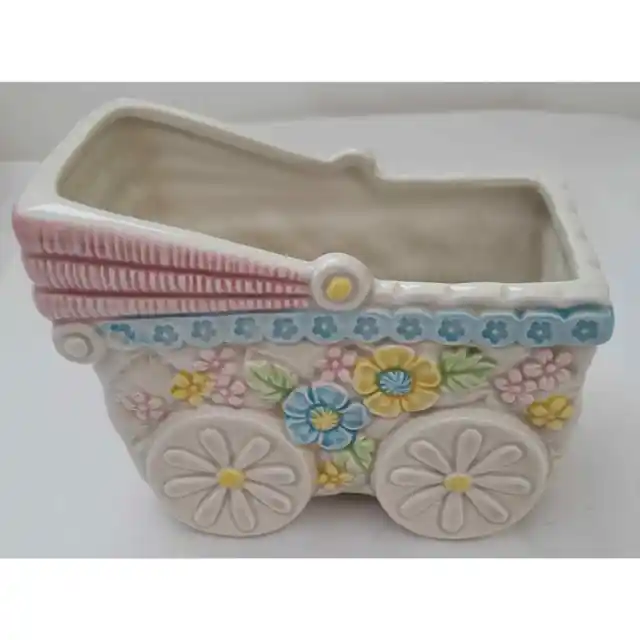 Vintage baby buggy ceramic planter container.