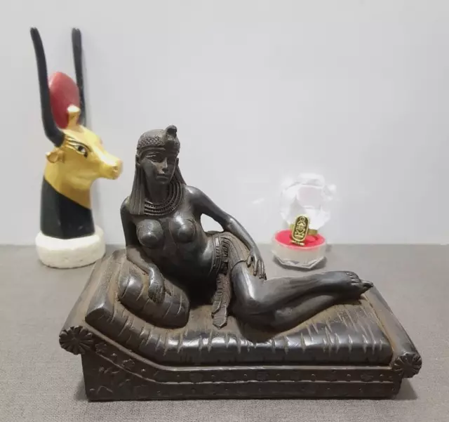 Beautiful Queen Cleopatra Statue sitting on her throne from antique Stone