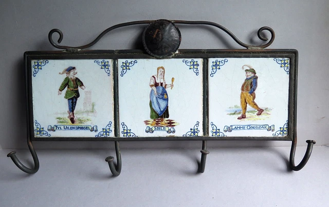 A 20th CENTURY RUSTIC WROUGHT IRON AND DELFT TILE KITCHEN TOWEL RACK (Nele etc)