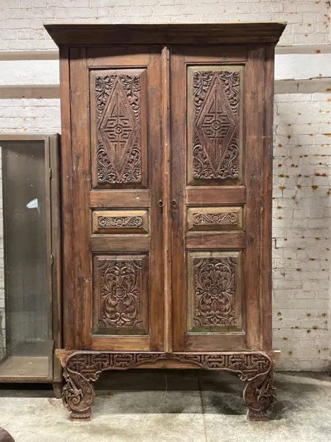 Large solid wood carved Antique Indonesian cupboard