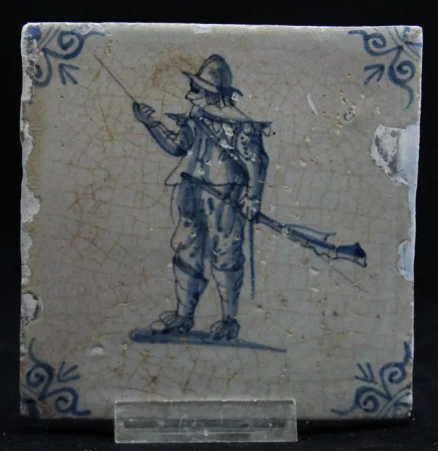 antique 17th C. Delft blue Tile, marching Soldier with musket and sword, ca.1650