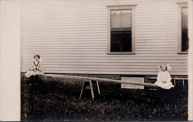 1912 Two Girls Playing on a Teeter Totter, WEST PARIS, Maine Real Photo Postcard