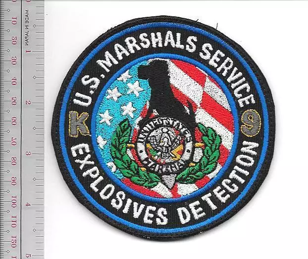 US Marshals Service K-9 Explosives Detection Agent and Canine Team Vel hooks