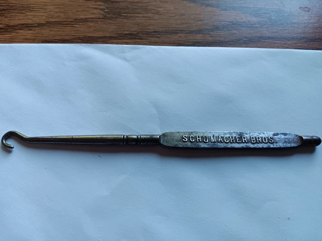 Vintage 6 1/8" shoe button hook from Schumacher Bros. 105 Grand Ave.