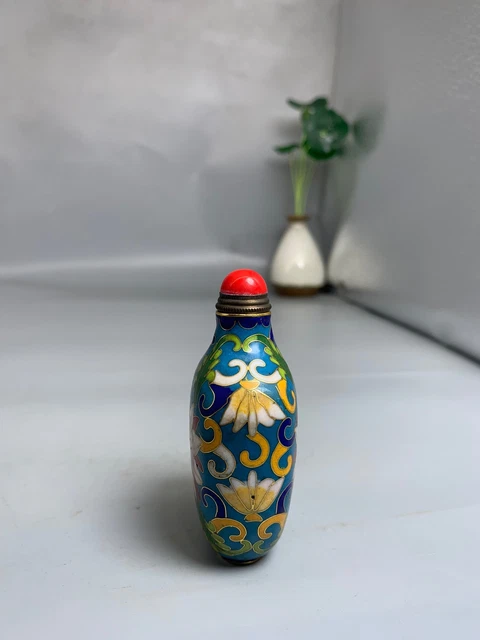 Collection of Hand-carved Cloisonné Snuff Bottles on Purple Copper
