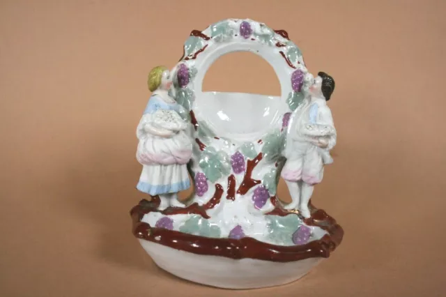Seltener Taschenuhrhalter/Taschenuhrständer Porzellan Figurengruppe um 1900