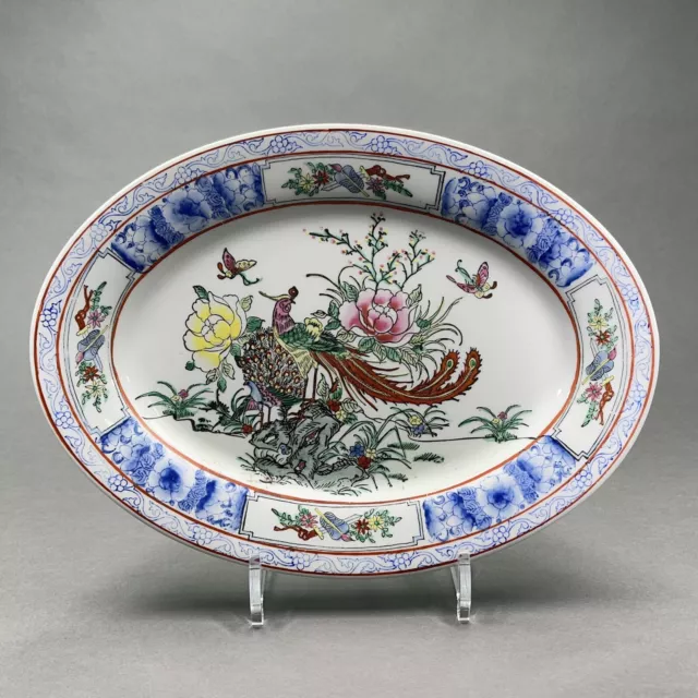 Plat ovale en porcelaine de Chine décor paon et fleurs