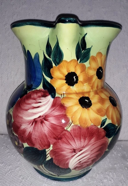 Teiera vintage in smalto floreale: manico in ceramica, bollitore