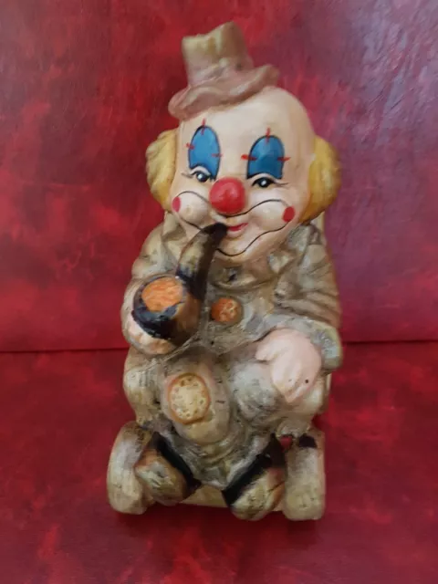 Magnifique tirelire - Petit clown fumant sa pipe