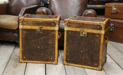 Handmade matching pair of antique leather finished occasional side table trunks