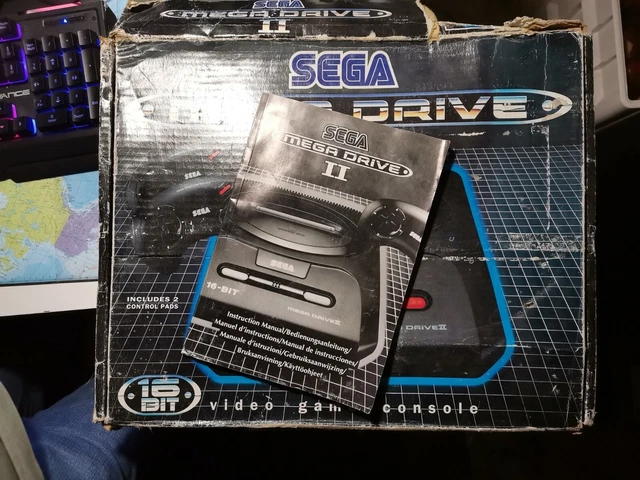 A Sega Mega Drive II with various games & original box (untested