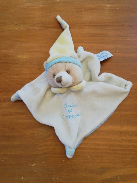 O/ Doudou Et Compagnie Ours Plat Carré Blanc Bleu Jaune Bonnet