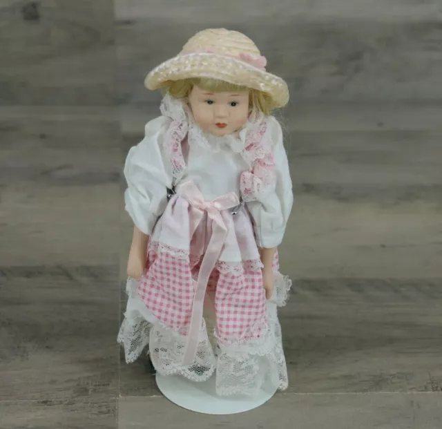 Miniature Porcelain Little Girl Doll in Plaid Apron Dress with Straw Hat