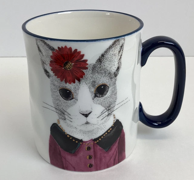 Ceramic mug with kitty in dress and flower