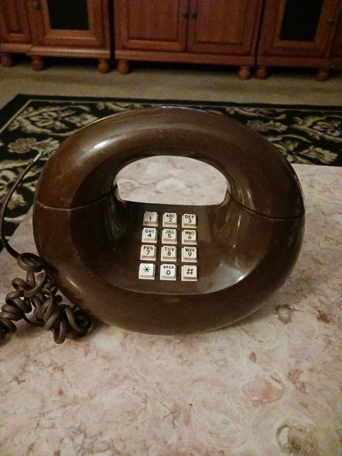 Teléfono redondo donut vintage década de 1970 eléctrico occidental