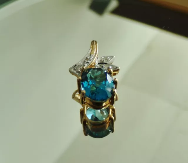 Oval Blue Topaz Diamond Accent Pendant Ladies 14K Yellow Gold Charm