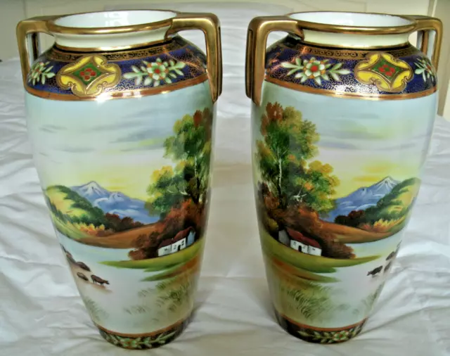 A  Stunning Pair of Gold Encrusted Noritake 10.5 inch Scenic Vases