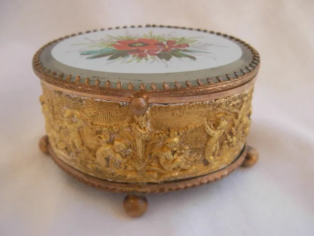 ANTIQUE FRENCH GILT EMBOSSED METAL,ENAMELED GLASS TOP JEWEL BOX,LATE 19th.