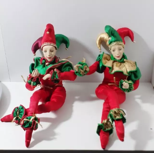 Vintage Porcelain & Fabric 13" Poseable Red & Green Sitting Jester Doll Set Of 2