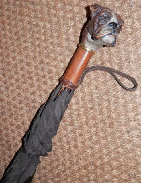 Umbrella with dog head handle outlet