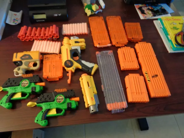 Large collection of Nerf items Guns,magazines ammo clips,scope,darts