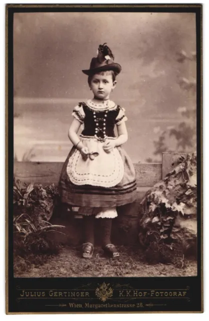 Photography Julius Gertinger, Vienna, cute girl in costume dress with feed