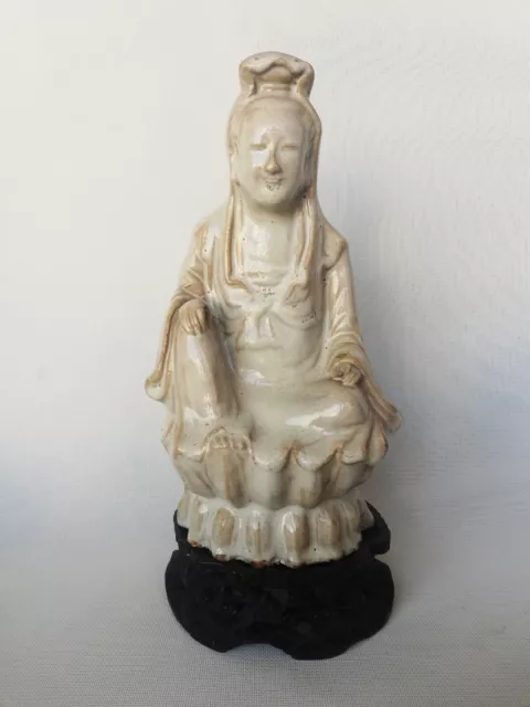 A White Glazed Crackle Porcelain Figure Of Guanyin