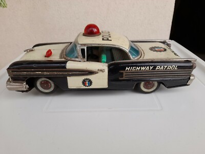 LATTA POLICE OLDSMOBILE PATROL CAR Nomura TIN TOYS BATTERY  JAPAN CM 30 