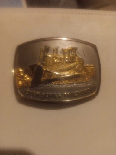 Caterpillar Belt Buckle 1986 - CAT N SERIES TRACTORS W/ GOLD TRACTOR