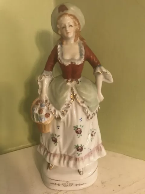 Vintage 10 1/4" Porcelain  Victorian Figurine Woman with Flowers Occupied Japan