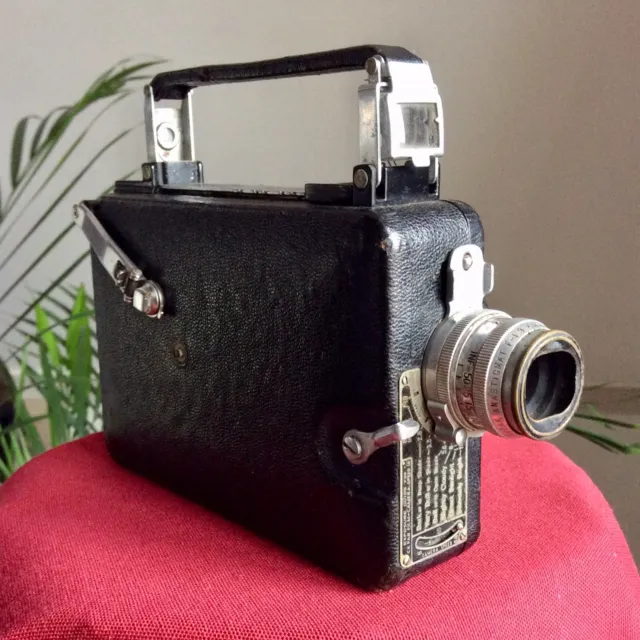 Cámara antigua de 16 mm revista vintage década de 1930 Cine Kodak, lente Anastigmat f1,9 25 mm