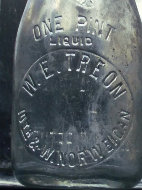 1 pint W. E. Treon 10th & West Norwegian clear embossed glass Milk Bottle