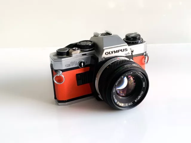 Olympus OM10 35mm SLR Film Camera w Zuiko 50mm 1.8 Lens Orange Leathe NEW SEALS