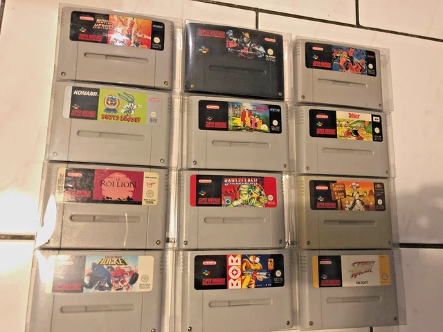 Lot 12 jeux SNES, super nintendo - bob addams asterix roi lion art of fighting..