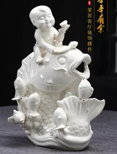 11" Dehua White Porcelain Fengshui Tongzi Kid Boy Ride Fish Yuanbao Money Statue