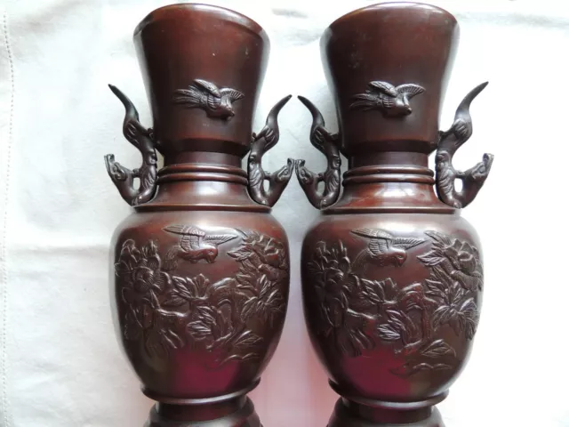 A pair of late 19th century / early 20th century Japanese bronze vases, 30cms