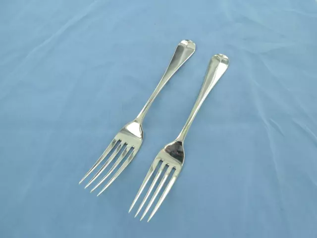 An antique sterling silver pair of old English dinner forks. London 1854.