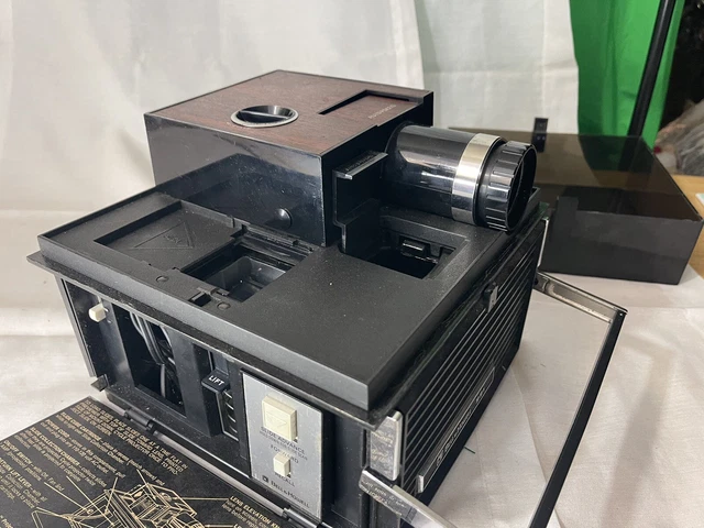 Proyector de diapositivas Bell & Howell 4234071 cubo de diapositivas 991 ventilador y luz de enfoque automático