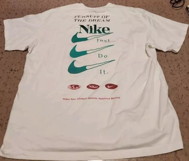 Camiseta deportiva global Nike para hombre (L) calce holgado PERSUIT OF THE DREAM 26,5x 22"