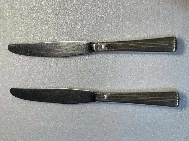 Pair of vintage NYC railroad dining car silver plated dinner knives.