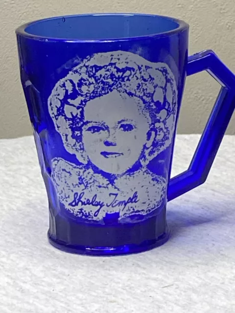 https://www.picclickimg.com/5SAAAOSwiI9j8lV0/1930s-Reproduction-Shirley-Temple-Cobalt-Blue-Glass-Handled.webp
