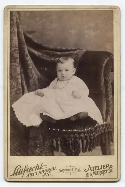 Cabinet Card  Baby In Christening Gown On Comfy Chair. Pittsburgh, Pa.