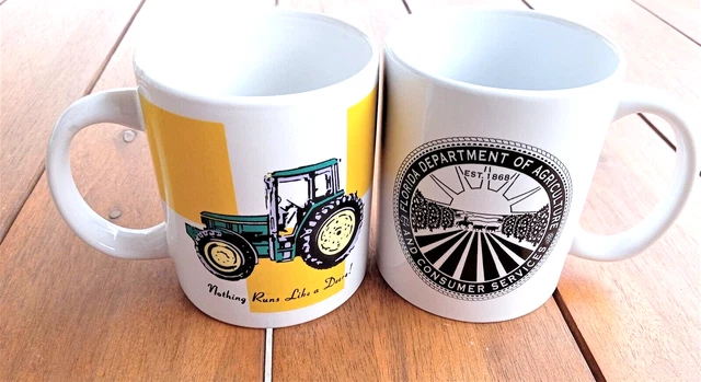 2 Coffee Cups John Deere Tractor + Dept of Ag coffee mugs