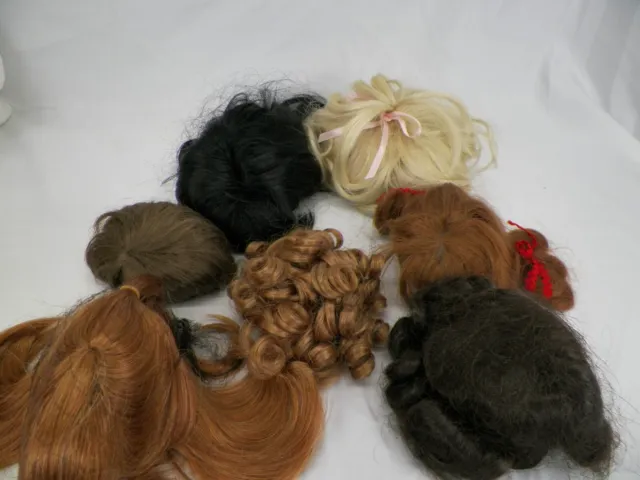 Lot of 8 Doll Hair Wigs. Assortment of Sizes and Colors