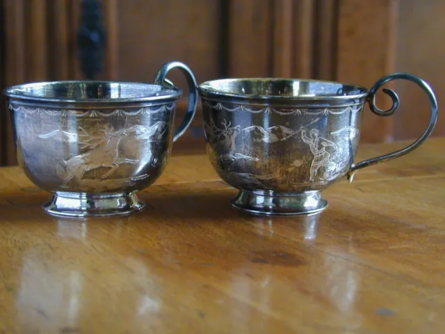 PAIR OF SWEDISH SILVER BRANDY CUPS. ENGRAVED WITH SKIING HUNTER. HM 1955 by COP.